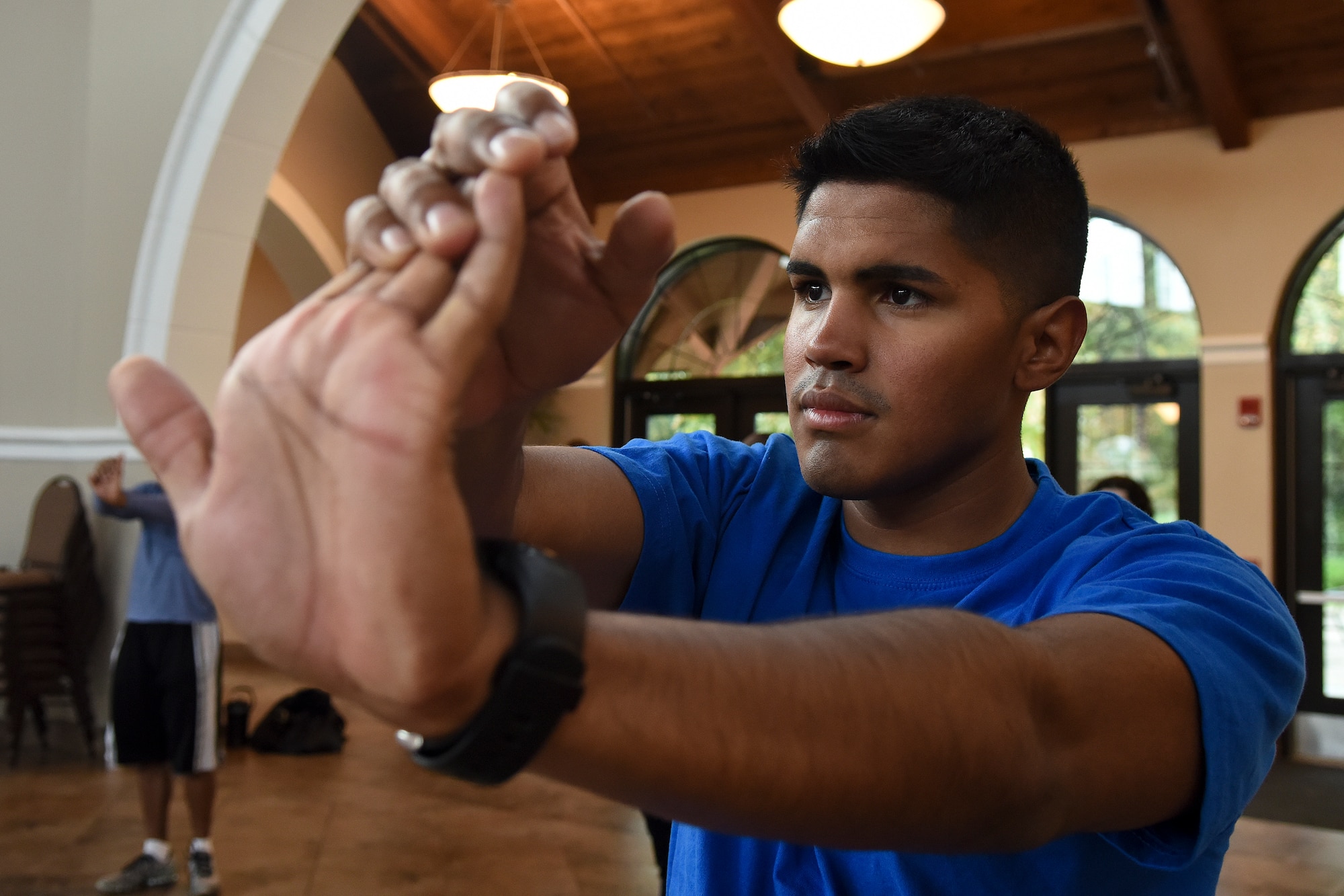 Army Sgt. Jon Cintron, Headquarters and Headquarters Battalion 82nd Airborne Division military intelligence systems maintainer, stretches during the USO of North Carolina Warrior Reset retreat, Nov. 4, 2015, at the Cape Fear Botanical Garden in Fayetteville, North Carolina. Instructors at the resilience seminar taught the importance of maintaining a healthy body and mind during several exercise and nutrition sessions. (U.S. Air Force photo/Senior Airman Aaron J. Jenne)