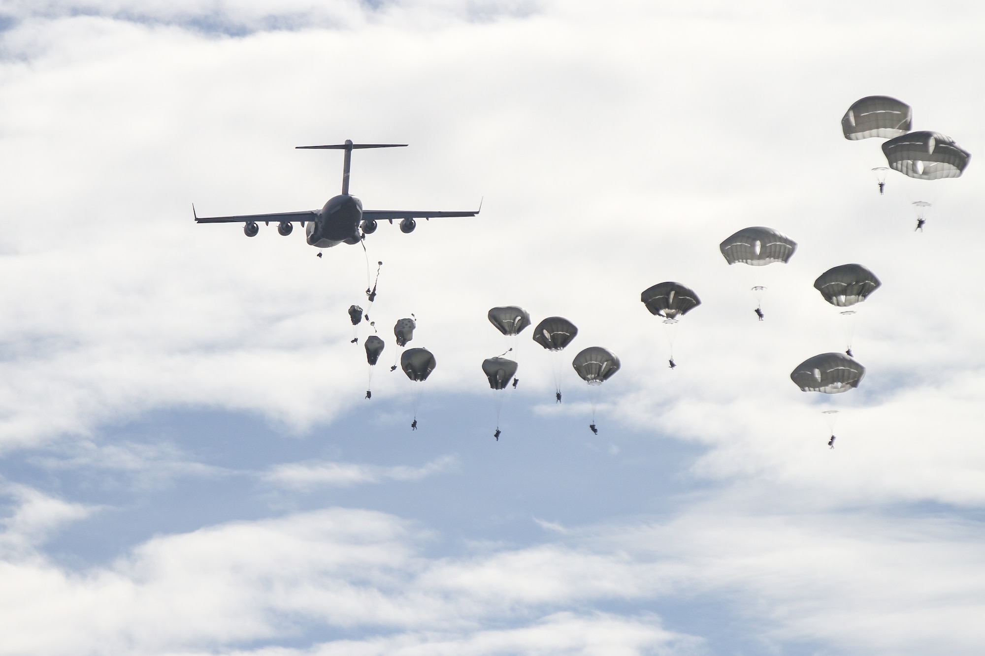 U.S. Army Paratroopers assigned to the 2nd Brigade Combat Team, 82nd Airborne Division parachute from C-17 Globemaster III aircraft for a joint forcible entry operation during the Joint Land Heavy Military Demonstration of Operation Trident Juncture; the largest NATO exercise conducted in the past 20 years, near San Gregorio, Spain, Nov. 4, 2015. U.S. and NATO forces remain engaged, postured and ready to assure, deter and defend in an increasingly complex security environment. (U.S. Army photo by Staff Sgt. Jason Hull)