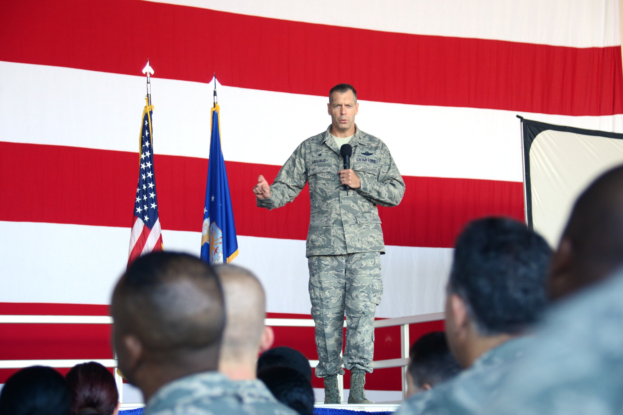 Col. David P. Garfield speaks during his first Commander’s Call Nov. 6 at Homestead Air Reserve Base, Fla. inside Hanger 200. (U.S. Air Force photo/Senior Airman Frank Casciotta)  