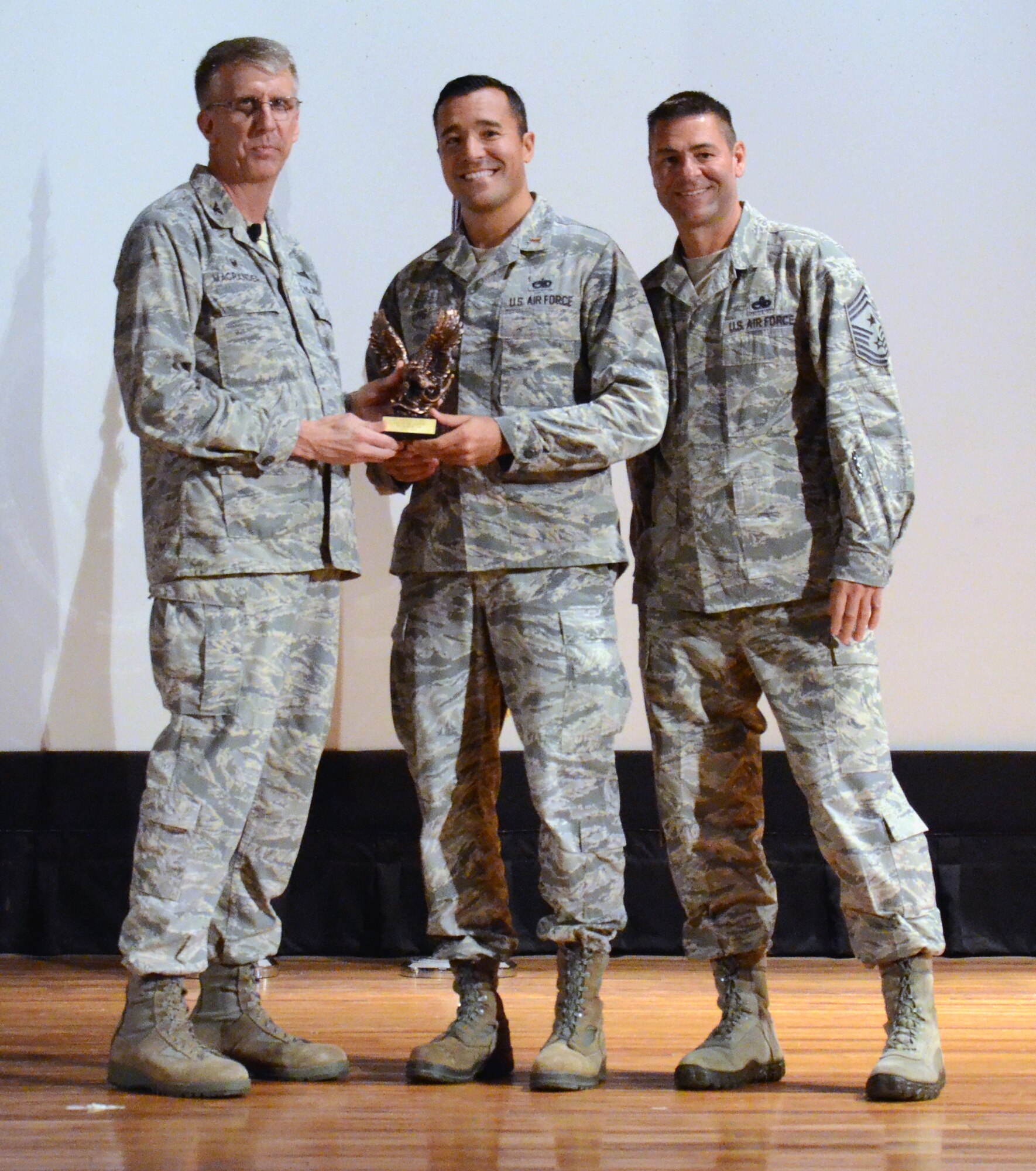 Company Grade Officer of the Quarter for the first quarter of 2015 2nd Lt. Michael Ling (center), 920th Aircraft Maintenance Squadron, along with 920th Rescue Wing Commander Col. Jeffrey Macrander (left) and wing Command Chief, Chief Master Sgt. Timothy Bianchi (right). (U.S. Air Force photo/Master Sgt. Paul Flipse) 