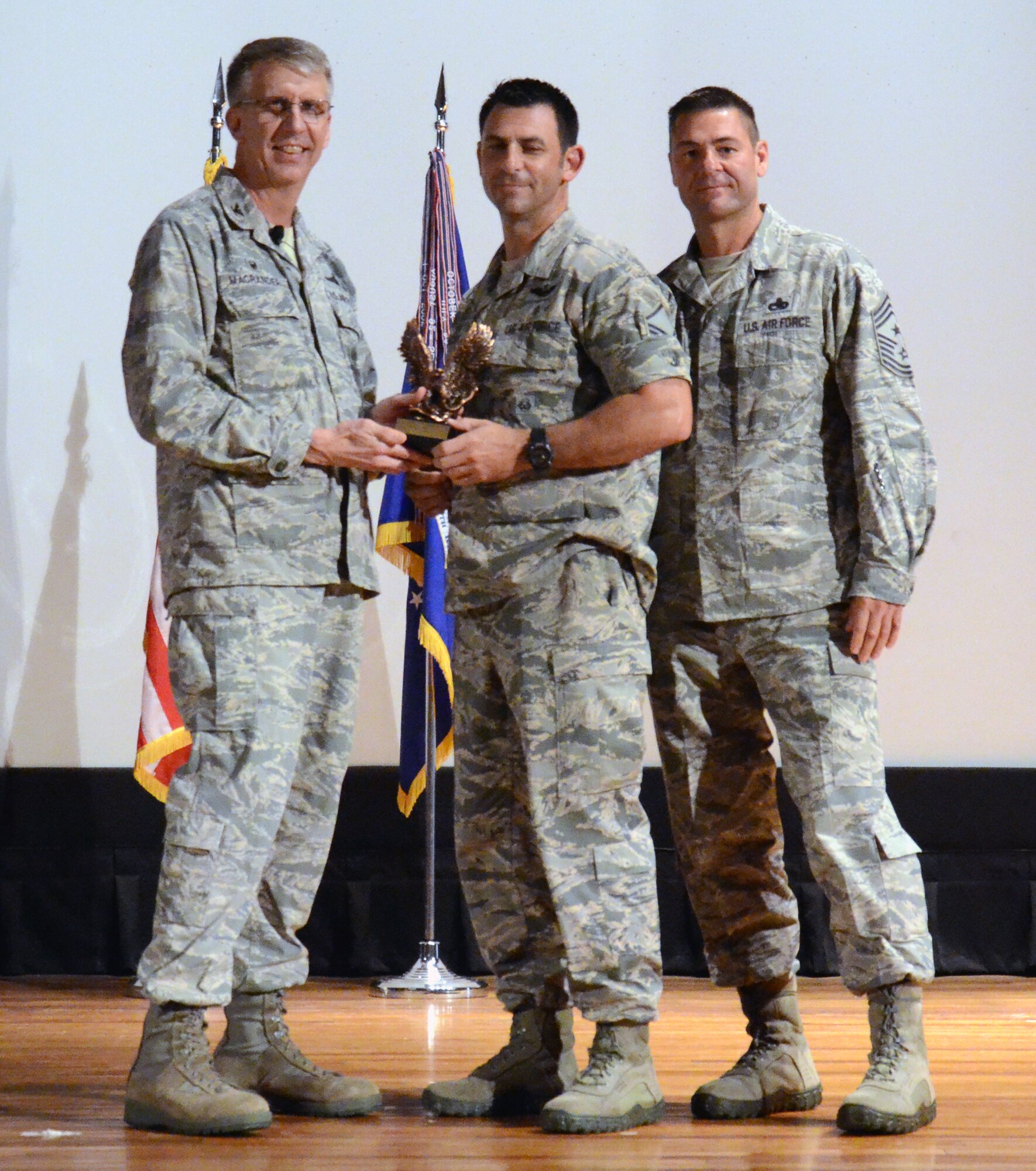 Senior NCO of the Quarter for the first quarter of 2015 Master Sgt. Robert Carcieri (center), 308th Rescue Squadron, along with 920th Rescue Wing Commander Col. Jeffrey Macrander (left) and wing Command Chief, Chief Master Sgt. Timothy Bianchi (right). (U.S. Air Force photo/Master Sgt. Paul Flipse) 