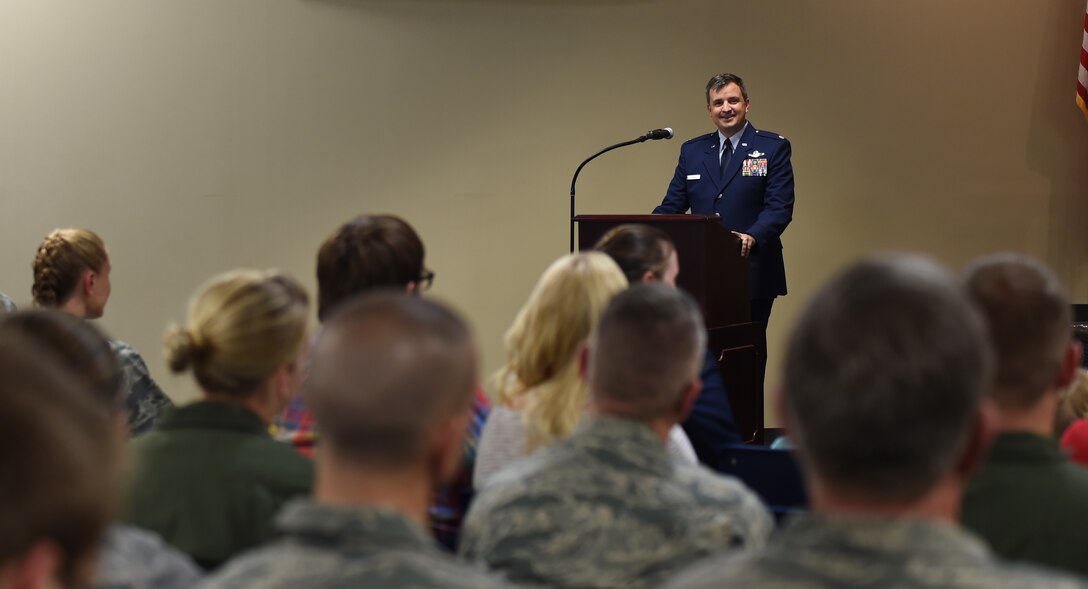 Lt. Col. Patric Coggin expresses his goals as the newly appointed commander of the 188th Operations Support Squadron during a formal assumption of command ceremony at Ebbing Air National Guard Base, Fort Smith, Ark., Nov. 7, 2015. Coggin stated that the three key qualities that he and the 188th OSS must uphold are integrity, taking care of Airmen and executing the mission. (U.S. Air National Guard photo by Staff Sgt. Hannah Dickerson/Released)