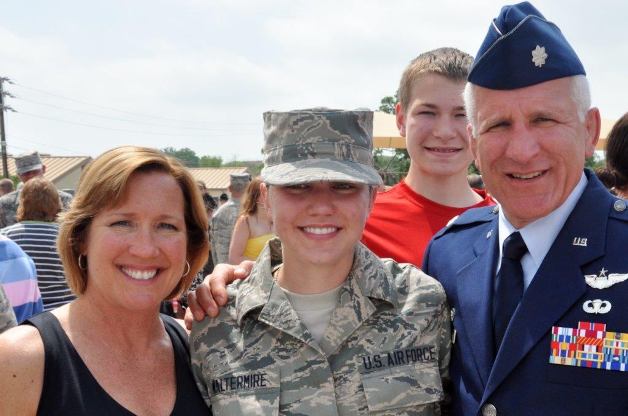 The Waltermire family surrounds Senior Airman Brigette Waltermire after she successfully completed Basic Military Training at Lackland Air Force Base, San Antonio, in 2013. 