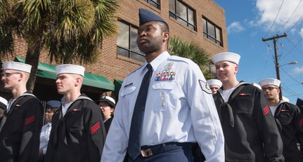 Joint Base Charleston members, both Air Force and Navy, march together through downtown Charleston, S.C., during the Veteran’s Day Parade on Nov. 7, 2015. Besides active duty military, veterans, military supporting organizations, volunteers, Junior Reserve Officer Training Corps units and the North Charleston High School marching band also were in attendance. (U.S. Air Force photo/Airman 1st Class Thomas T. Charlton)