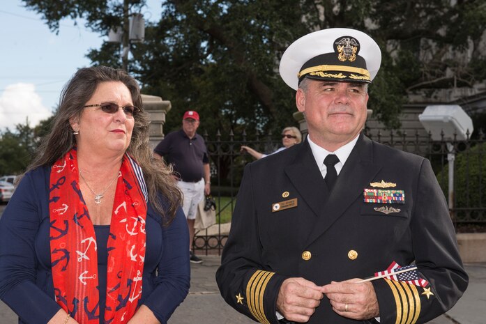 Captain Timothy Sparks, Joint Base Charleston deputy commander, with his wife, Brenda, stands in support of the Veteran’s Day Parade in downtown Charleston, S.C.  Active duty military, veterans, military supporting organizations, volunteers, Junior Reserve Officer Training Corps units and the North Charleston High School marching band also were in attendance. (U.S. Air Force photo/Airman 1st Class Thomas T. Charlton)