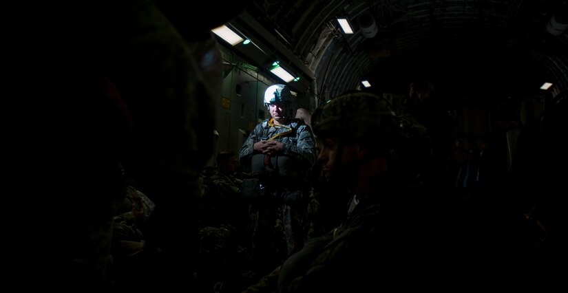 A Soldier with the 82nd Airborne Division waits for the time to jump during exercise Ultimate Reach Nov. 4, 2015, while flying over Europe. Ultimate Reach is an annual U.S. Transportation Command-sponsored live-fly exercise designed to exercise the ability of the 18th Air Force to plan and conduct strategic airdrop missions. This iteration of Ultimate Reach partnered with NATO Exercise Trident Juncture being held in locations across Europe. (U.S. Air Force photo/Airman 1st Class Clayton Cupit)