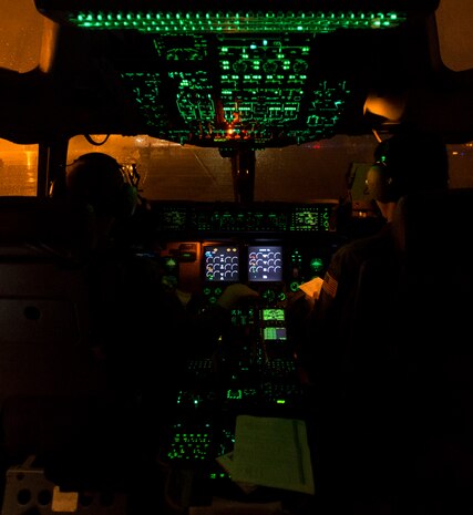 Capt. Samuel Weir, 15th Airlift Squadron pilot, and 1st Lt. James Schuh, 15th AS pilot, make preflight checks during Exercise Ultimate Reach 16, Nov. 4, 2015, on the flightline at Pope Army Airfield, N.C. Ultimate Reach is an annual U.S. Transportation Command-sponsored live-fly exercise designed to exercise the ability of the 18th Air Force to plan and conduct strategic airdrop missions. This iteration of Ultimate Reach partnered with the NATO Exercise Trident Juncture being held in locations across Europe. (U.S. Air Force photo/Airman 1st Class Clayton Cupit)
