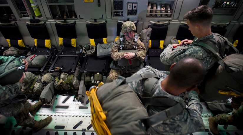 A Soldier with the 82nd Airborne Division waits for the time to jump during Exercise Ultimate Reach 16, Nov. 4, 2015, while flying over Europe. Ultimate Reach is an annual U.S. Transportation Command-sponsored live-fly exercise designed to exercise the ability of the 18th Air Force to plan and conduct strategic airdrop missions. This iteration of Ultimate Reach partnered with the NATO Exercise Trident Juncture being held in locations across Europe. (U.S. Air Force photo/Airman 1st Class Clayton Cupit)