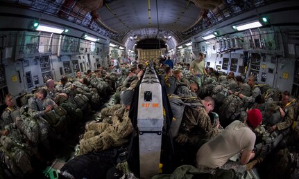 Soldiers with the 82nd Airborne Division wait for their time to jump during Exercise Ultimate Reach 16, Nov. 4, 2015, while flying over Europe. Ultimate Reach is an annual U.S. Transportation Command-sponsored live-fly exercise designed to exercise the ability of the 18th Air Force to plan and conduct strategic airdrop missions. This iteration of Ultimate Reach partnered with the NATO Exercise Trident Juncture being held in locations across Europe. (U.S. Air Force photo/Airman 1st Class Clayton Cupit)