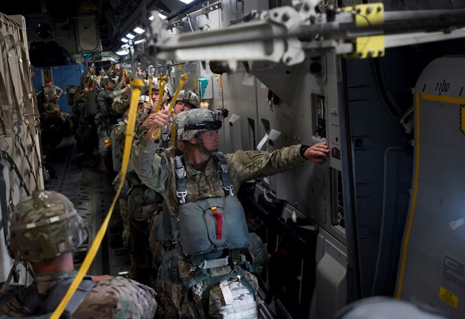 Soldiers with the 82nd Airborne Division wait for the green light to jump during Exercise Ultimate Reach 16, Nov. 4, 2015, while flying over Spain. Ultimate Reach is an annual U.S. Transportation Command-sponsored live-fly exercise designed to exercise the ability of the 18th Air Force to plan and conduct strategic airdrop missions. This iteration of Ultimate Reach partnered with the NATO Exercise Trident Juncture held in locations across Europe. (U.S. Air Force photo/Airman 1st Class Clayton Cupit)