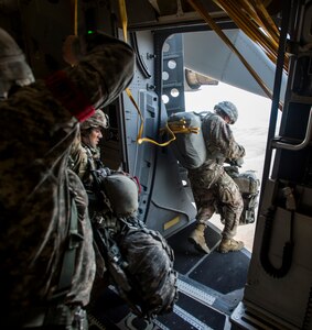 A Paratrooper from the 82nd Airborne Division gets the green light to jump during Exercise Ultimate Reach 16, Nov. 4, 2015, while flying over Spain. Ultimate Reach is an annual U.S. Transportation Command-sponsored live-fly exercise designed to exercise the ability of the 18th Air Force to plan and conduct strategic airdrop missions. This iteration of Ultimate Reach partnered with the NATO Exercise Trident Juncture being held in locations across Europe. (U.S. Air Force photo/Airman 1st Class Clayton Cupit)