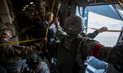 Soldiers from the 82nd Airborne Division get the green light to jump during Exercise Ultimate Reach 16, Nov. 4, 2015, while flying over Spain. Ultimate Reach is an annual U.S. Transportation Command-sponsored live-fly exercise designed to exercise the ability of the 18th Air Force to plan and conduct strategic airdrop missions. This iteration of Ultimate Reach partnered with the NATO Exercise Trident Juncture being held in locations across Europe. (U.S. Air Force photo/Airman 1st Class Clayton Cupit)