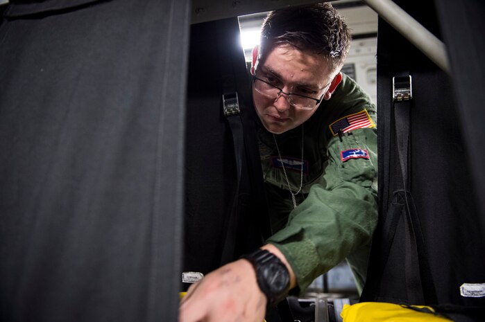 Senior Airman Eric Parkin, 15th Airlift Squadron loadmaster, performs pre-flight checks on a C-17 Globemaster III during Exercise Ultimate Reach 16, Nov. 4, 2015, on the flightline at Pope Army Airfield, N.C. Ultimate Reach is an annual U.S. Transportation Command-sponsored live-fly exercise designed to exercise the ability of the 18th Air Force to plan and conduct strategic airdrop missions. This iteration of Ultimate Reach partnered with the NATO Exercise Trident Juncture held in various locations across Europe. (U.S. Air Force photo/Airman 1st Class Clayton Cupit)