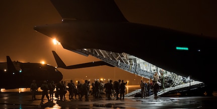 Soldiers from the 82nd Airborne Division wait to board a C-17 Globemaster III during Exercise Ultimate Reach 16, Nov. 4, 2015, on the flightline at Pope Army Airfield, N.C. Ultimate Reach is an annual U.S. Transportation Command-sponsored live-fly exercise designed to exercise the ability of the 18th Air Force to plan and conduct strategic airdrop missions. This iteration of Ultimate Reach partnered with the NATO Exercise Trident Juncture held in various locations across Europe. (U.S. Air Force photo/Airman 1st Class Clayton Cupit)
