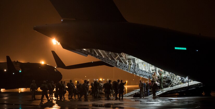 Soldiers from the 82nd Airborne Division wait to board a C-17 Globemaster III during Exercise Ultimate Reach 16, Nov. 4, 2015, on the flightline at Pope Army Airfield, N.C. Ultimate Reach is an annual U.S. Transportation Command-sponsored live-fly exercise designed to exercise the ability of the 18th Air Force to plan and conduct strategic airdrop missions. This iteration of Ultimate Reach partnered with the NATO Exercise Trident Juncture held in various locations across Europe. (U.S. Air Force photo/Airman 1st Class Clayton Cupit)