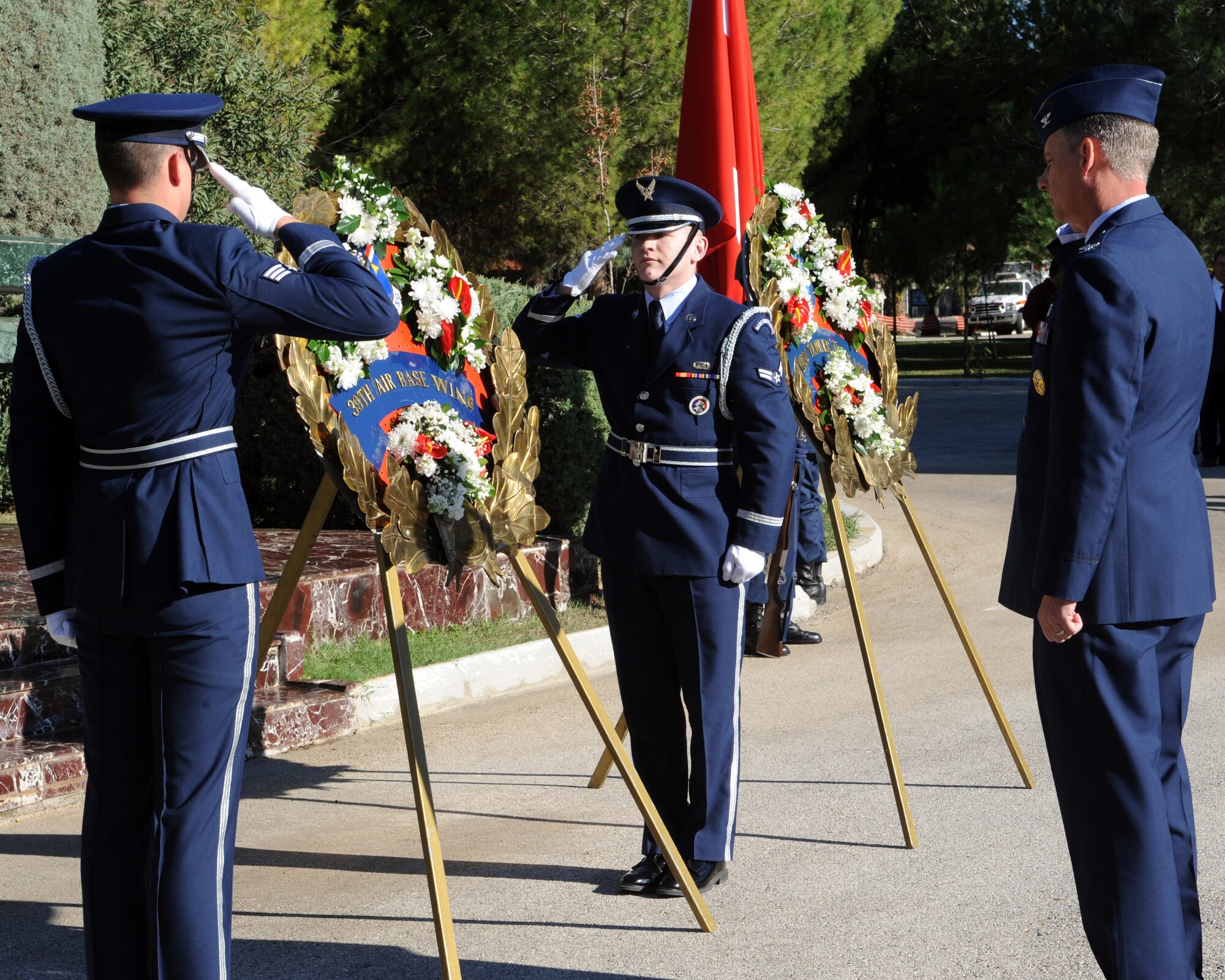 U.S. Air Force service members salute a memorial wreath to honor Mustafa Kemal Ataturk, founder and first president of the modern Republic of Turkey, during a memorial service Nov. 10, 2015, at Incirlik Air Base, Turkey. The 39th Air Base Wing honor guard posted a ceremonial wreath and rendered the appropriate respects to honor Ataturk. (U.S. Air Force photo by Airman 1st Class Daniel Lile/Released)
