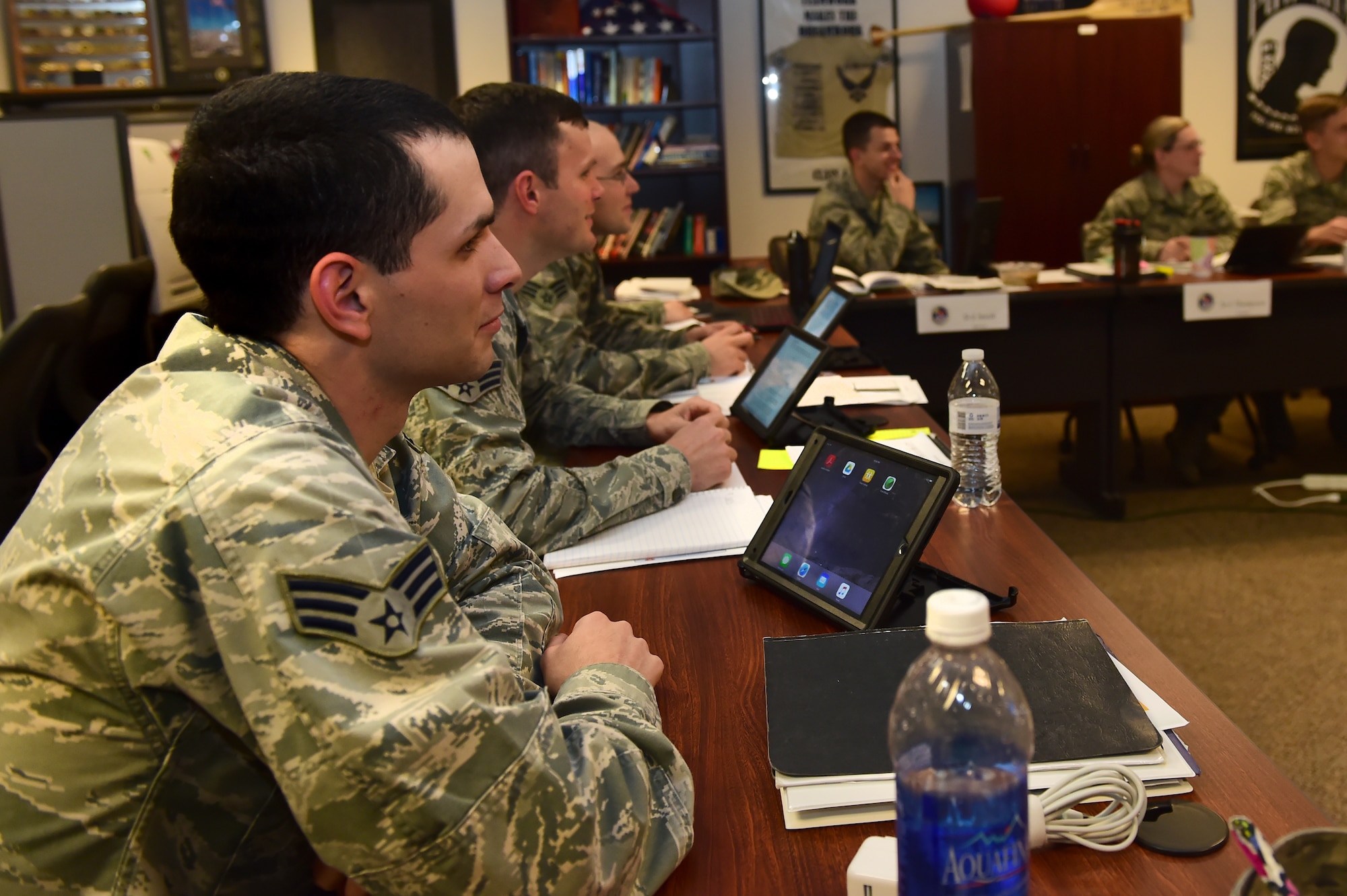 Airman Leadership School Students use iPads to better interact with instructors during class Nov. 9, 2015, on Buckley Air Force Base, Colo. ALS instructors and students utilizes the capabilities of iPads in order to improve teaching techniques and reduce resource costs. (U.S. Air Force photo by Airman 1st Class Luke W. Nowakowski/Released)