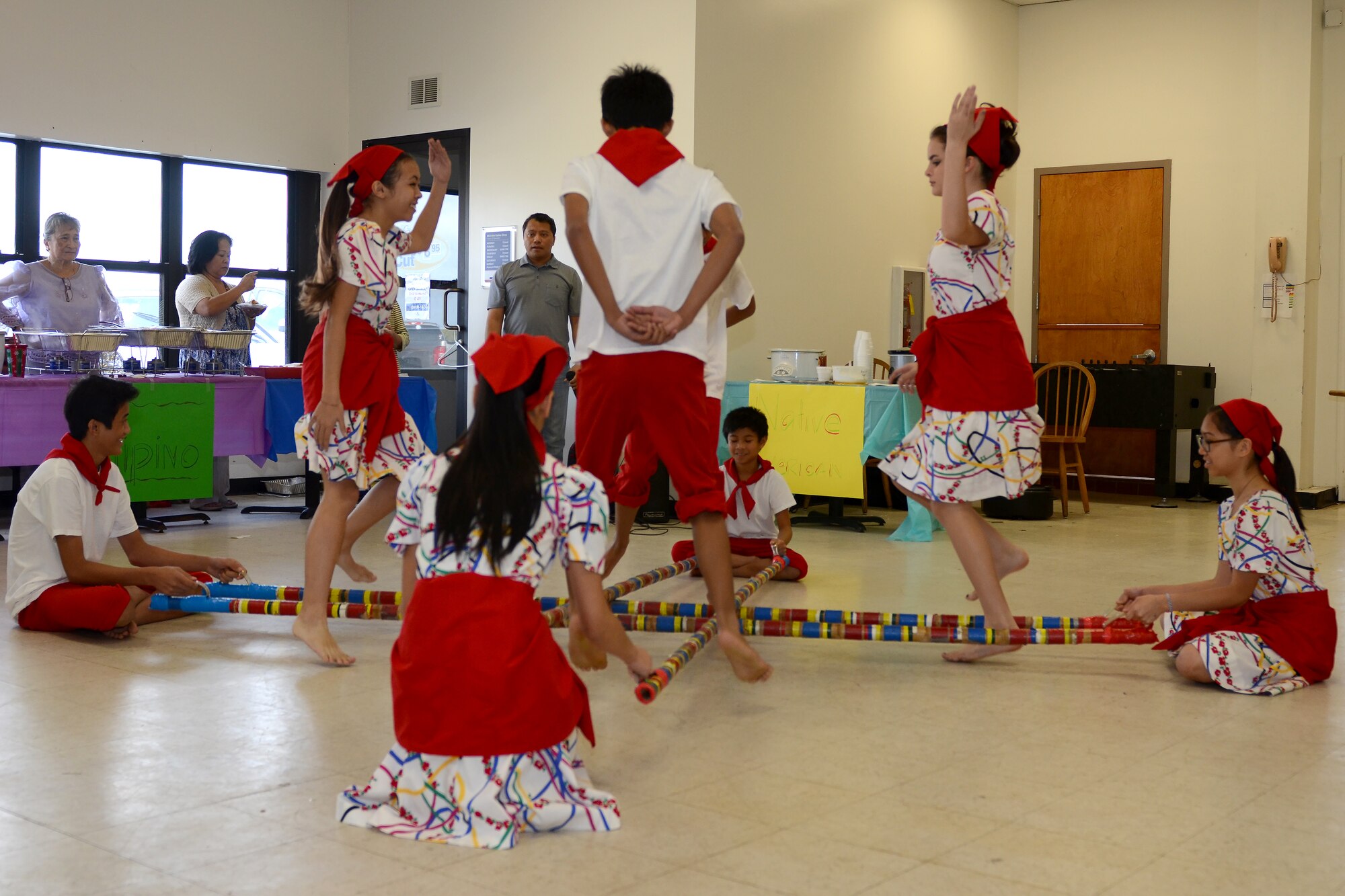 The teen and youth dance troop from the Filipino-American Association of Greater Columbia demonstrates the Filipino-originated Tinikling Dance during “A Taste of McEntire” diversity day celebration at McEntire Joint National Guard Base, S.C., Nov. 7, 2015. Diversity Day combines the Department of Defense's monthly diversity programs into a one day event for guardsmen to learn about other cultures and to celebrate diversity. (U.S. Air National Guard photo by Airman 1st Class Ashleigh Pavelek/RELEASED)