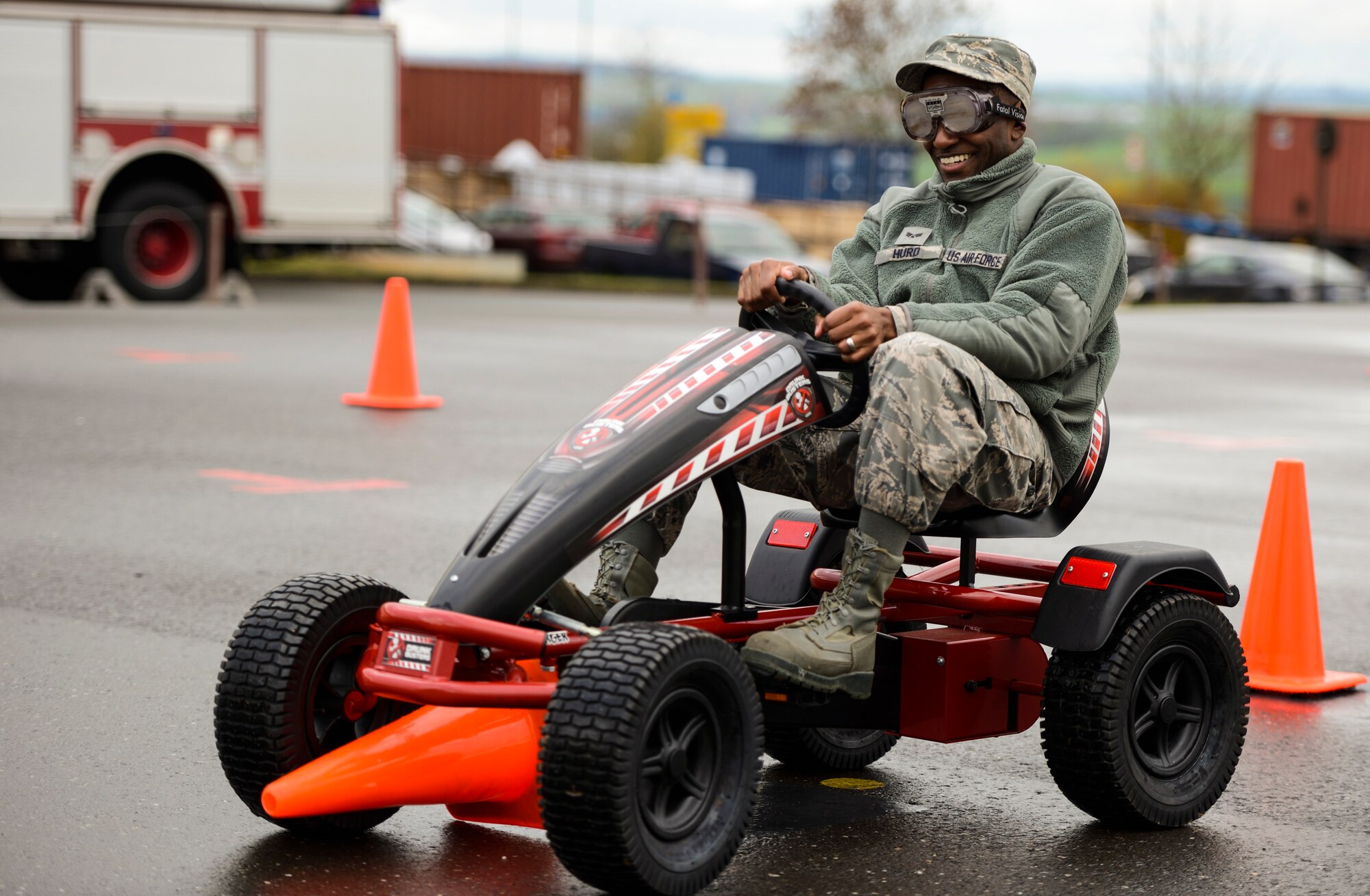 U.S. Air Force Senior Airman Mark Hurd, a 52nd Civil Engineer Squadron heating, ventilation and air conditioning technician, runs over a traffic cone while wearing drunk goggles on the Saber driving course during operation winterize, Nov. 6, 2015, at Spangdahlem Air Base, Germany. Drunk goggles simulate the effects of alcohol impairment which include reduced alertness, slowed reaction time, visual distortion, alteration of depth and distance perception, double vision and lack of muscular coordination. (U.S. Air Force photo by Staff Sgt. Christopher Ruano/Released)