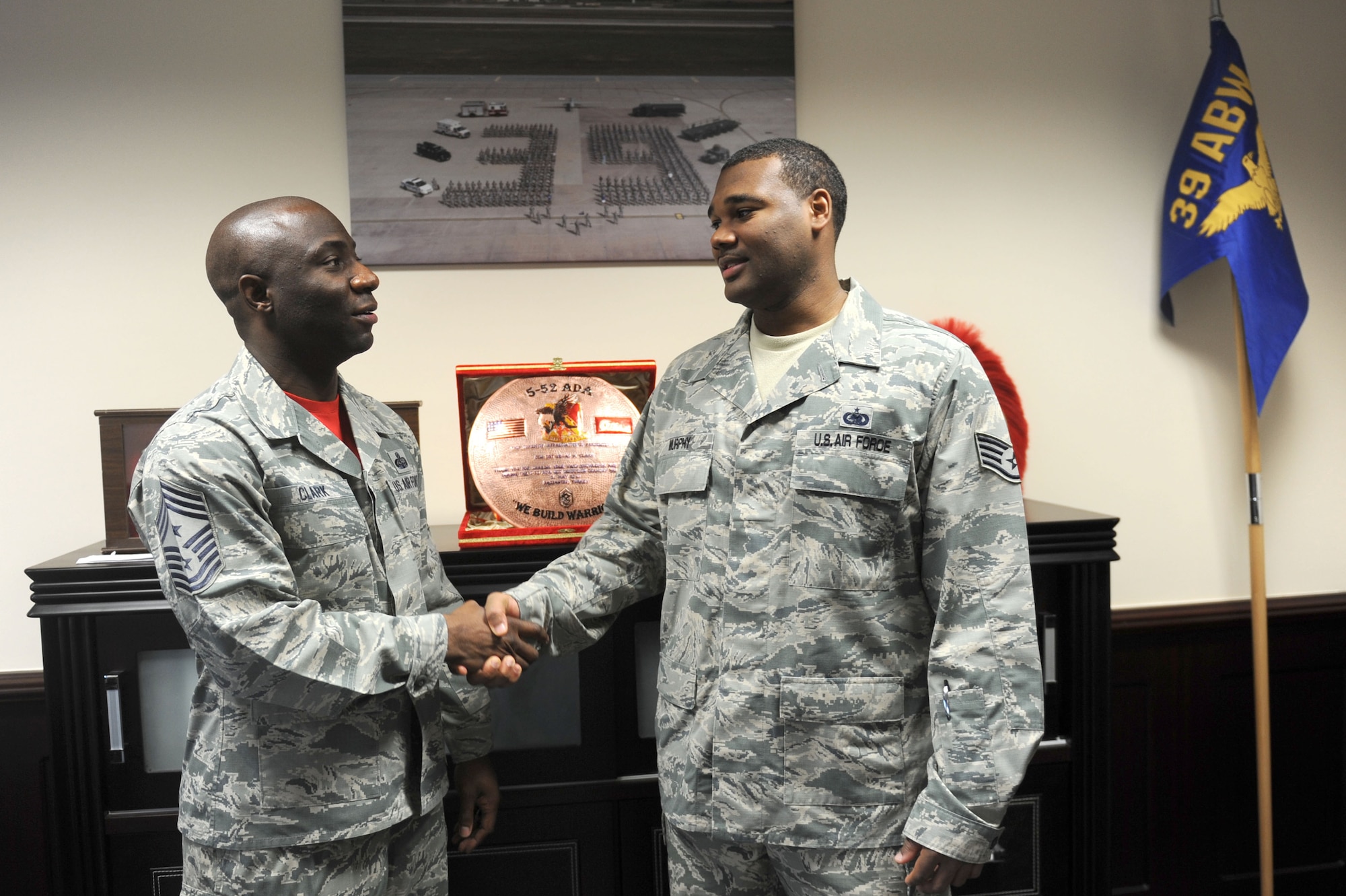 Chief Master Sgt. Vegas Clark, 39th Air Base Wing command chief, greets Staff Sgt. Andrew Murphy, 39th Logistics Readiness Squadron fuels service center supervisor, before beginning his chief shadow day Nov. 6, 2015.  Airmen are chosen for the command chief’s shadow program based on their commander’s recommendation about their dedication to the mission and their job. (U.S. Air Force photo by Tech. Sgt. Taylor Worley)