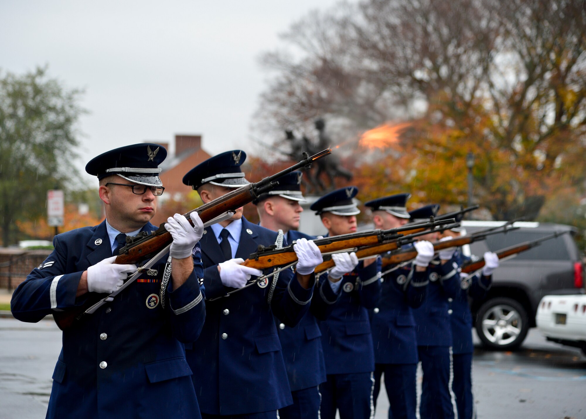 Airman 1st Class Brandon Willen-Nelson, Dover Air Force Base Honor Guard member, fires his M14 rifle during a 21-gun salute at a monument unveiling event Nov. 7, 2015, at Legislative Hall in Dover, Del. The new monument honors Delawareans who served in Operation Enduring Freedom and Operation Iraqi Freedom. (U.S. Air Force photo/Senior Airman William Johnson) 