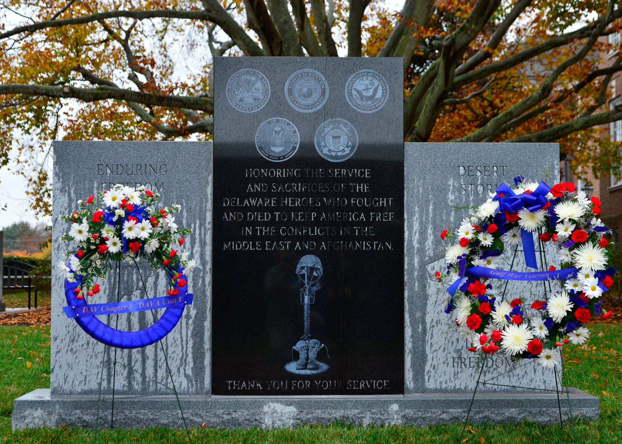A new monument is unveiled at Legislative Hall Nov. 7, 2015, in downtown Dover, Del. The monument honors Delawareans who served in the wars in the Middle East and Afghanistan. (U.S. Air Force photo/Senior Airman William Johnson)  
