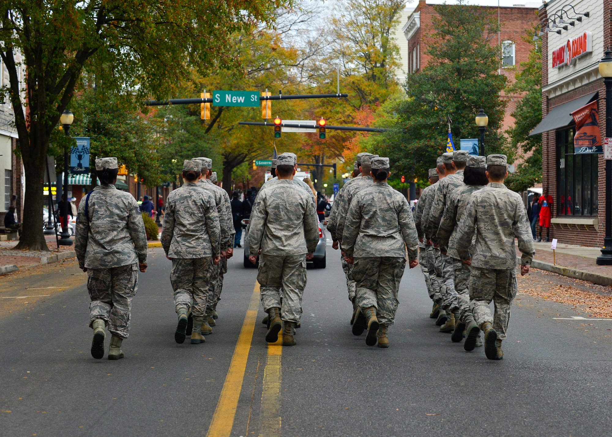 A Team Dover formation marches in the streets of downtown Dover, Del., during the 2015 Veterans Day Parade Nov. 5, 2015. The parade was followed by a monument dedication ceremony that honored veterans of Operation Iraqi Freedom and Operation Enduring Freedom. (U.S. Air Force photo/Senior Airman William Johnson)