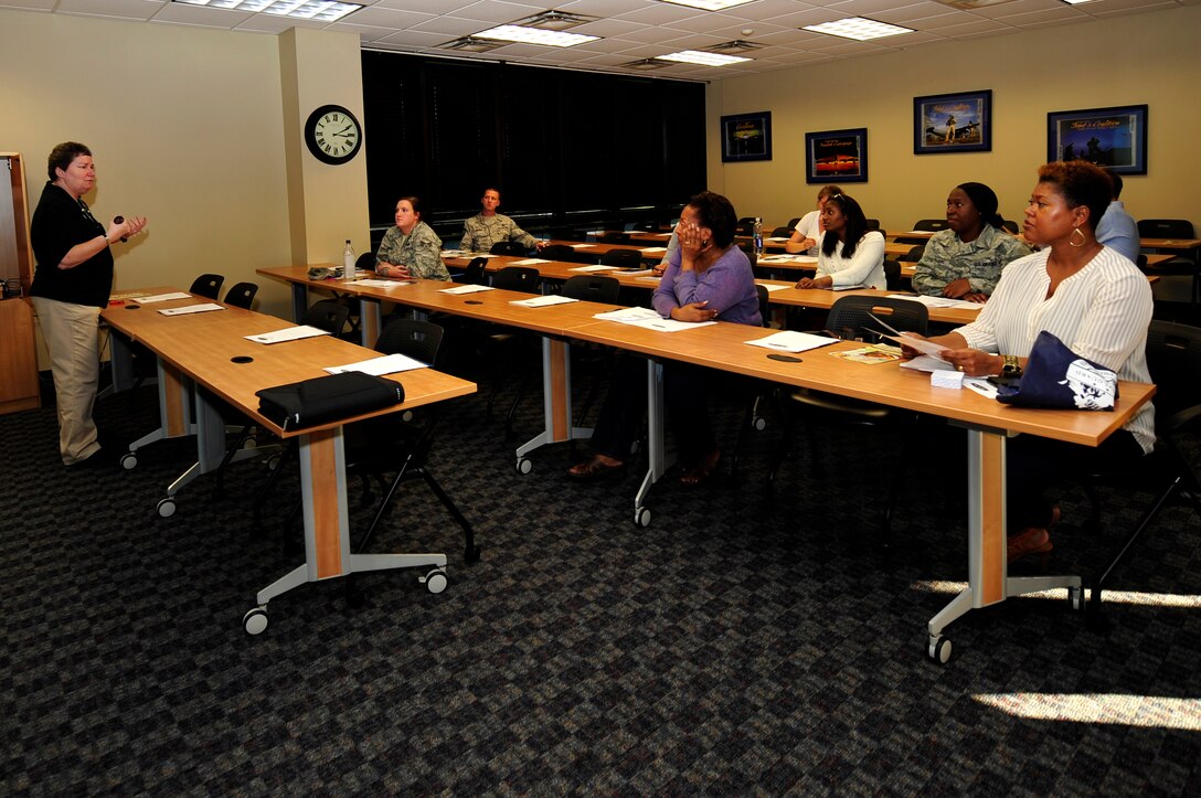 Sharon Rector, Army Community Service community readiness consultant, briefs patrons at a couponing class at Langley Air Force Base, Va., Nov. 6, 2015. To maximize saving, patrons were taught how to use multiple coupons for one item, along with other tips. (U.S. Air Force photo by Senior Airman Breonna Veal/Released)