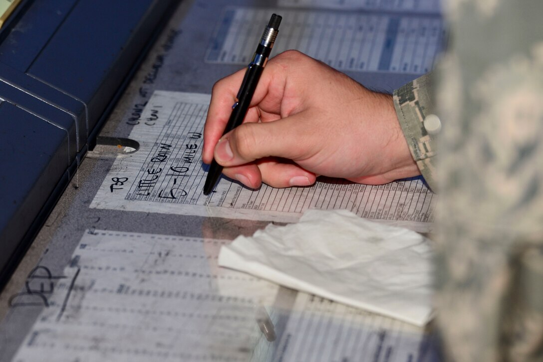 A U.S. Air Force Airman annotates changes to weather patterns in the air traffic control tower at Langley Air Force Base, Va., Nov. 4, 2015. The Airmen in the ATC tower are responsible for relaying air and ground changes to pilots. (U.S. Air Force photo by Airman 1st Class Derek Seifert/ Released)