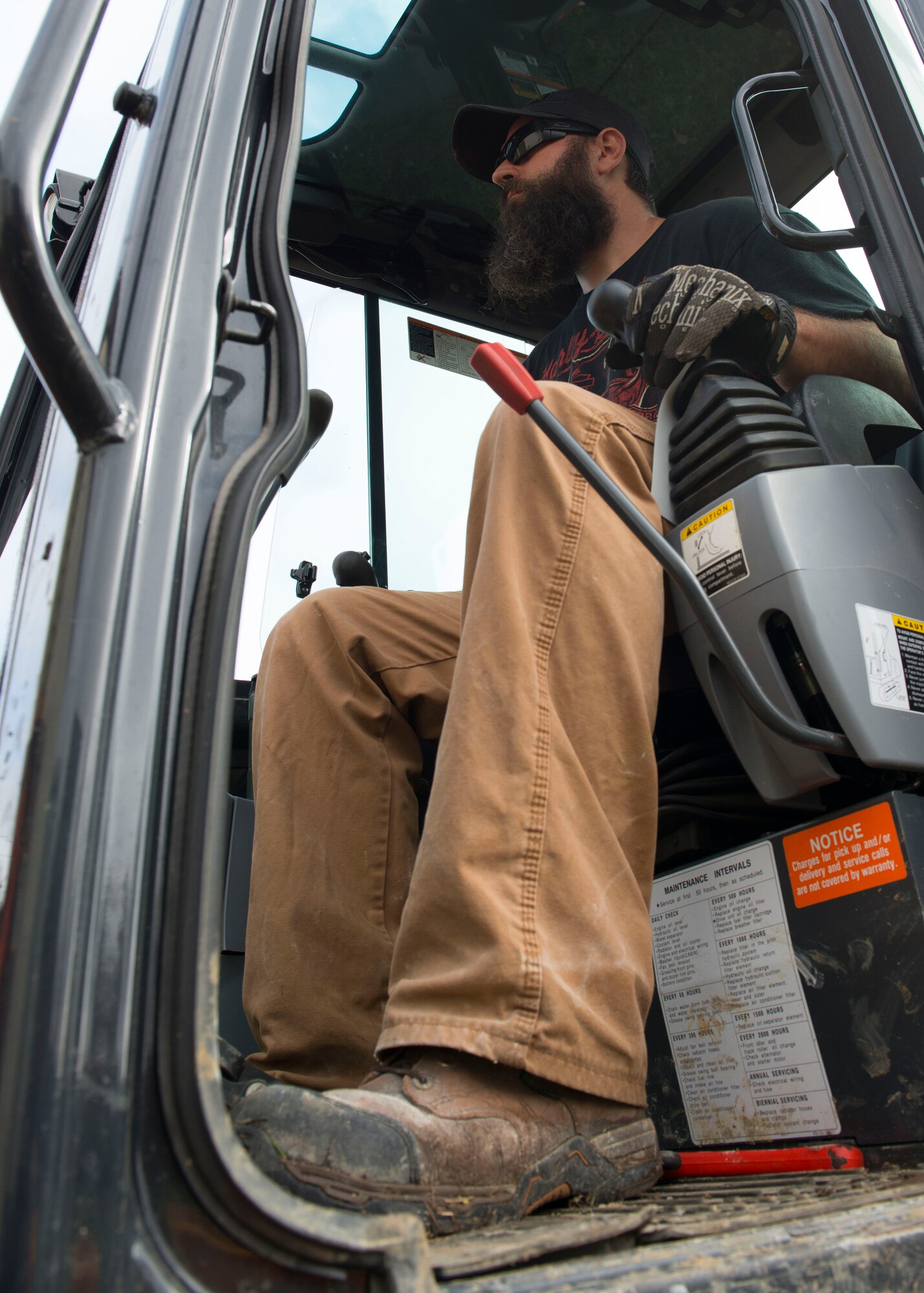 Andy Frantz, 633rd Civil Engineer Squadron water and fuel systems maintenance technician, operates an excavator at Langley Air Force Base, Va., Nov. 6, 2015. The excavator was used to move large amounts of concrete from the work area where repairs were being made. (U.S. Air Force photo by Staff Sgt. John D. Strong II/Released)