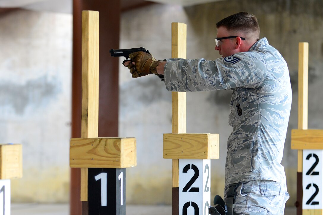 U.S. Air Force Staff Sgt. Jacob Brown, 633rd Security Forces Squadron noncommissioned officer in charge of police services and confinement, participates in the squadron’s Comprehensive Airmen Fitness day shoot-off competition at Langley Air Force Base, Va., Nov. 5, 2015. The SFS shooters put their training to the test by competing to find the sharpest Berretta M9 pistol handler. (U.S. Air Force photo by Senior Airman Kimberly Nagle/Released)