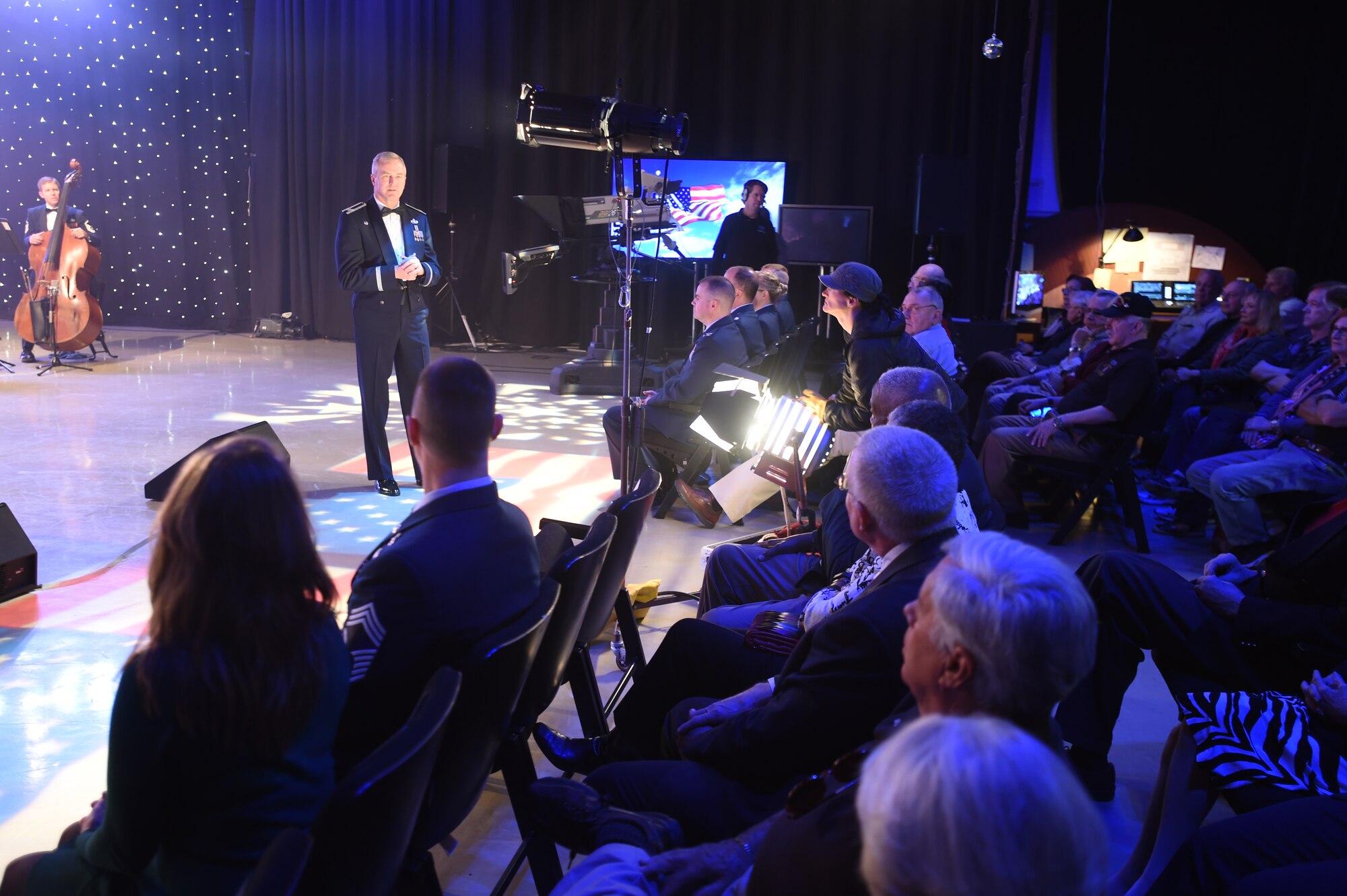 Col. Larry Lang, U.S. Air Force Band commander and conductor, speaks to the audience at the Maryland Public Television studio before a live recording of the band performing their Veteran’s Day tribute compositions in Owings Mills, MD., Nov. 06, 2015. The tribute particularly recognizes Vietnam veterans with music from the 60’s and 70’s. (U.S. Air Force photo/Senior Airman Joshua R. M. Dewberry)