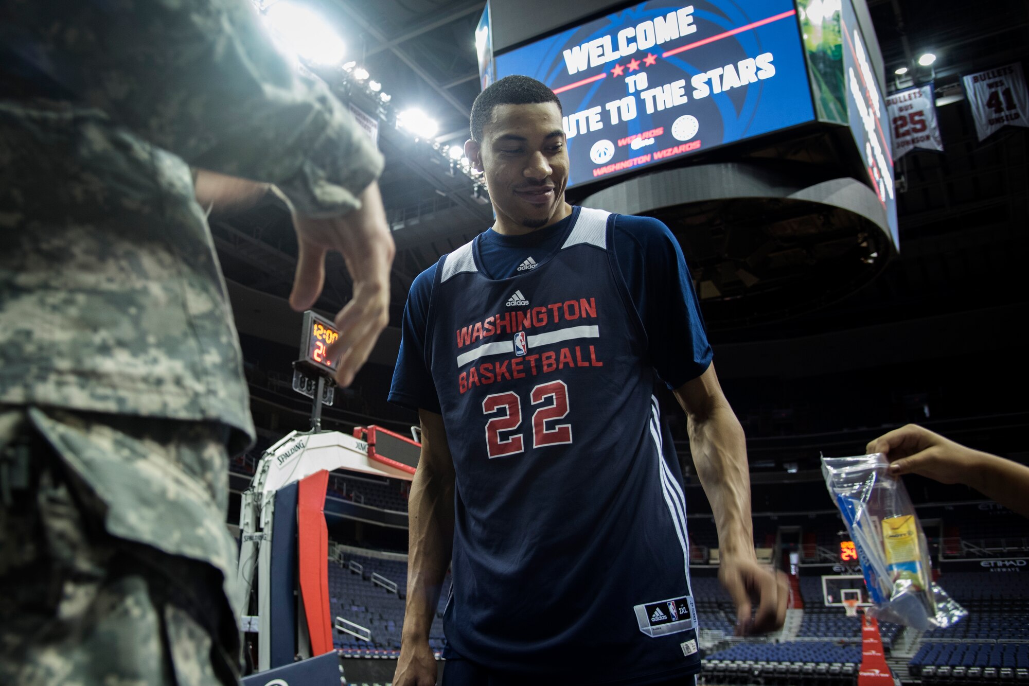 Otto Porter Jr., Washington Wizards small forward, bags up food during a Salute to the Stars event at the Verizon Center in Washington, D.C., Nov. 9, 2015. Salute to the Stars is an annual event held by the Wizards that included bagging food for homeless military veterans. (U.S. Air Force photo by Airman 1st Class Philip Bryant/Released)