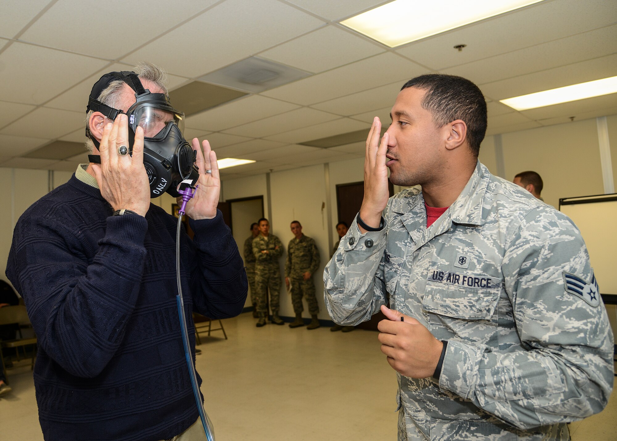 Some honorary commanders were selected to be fitted for gas masks at the Deployment Processing Area by 412th Medical Group Airmen. (U.S. Air Force photo by Rebecca Amber)