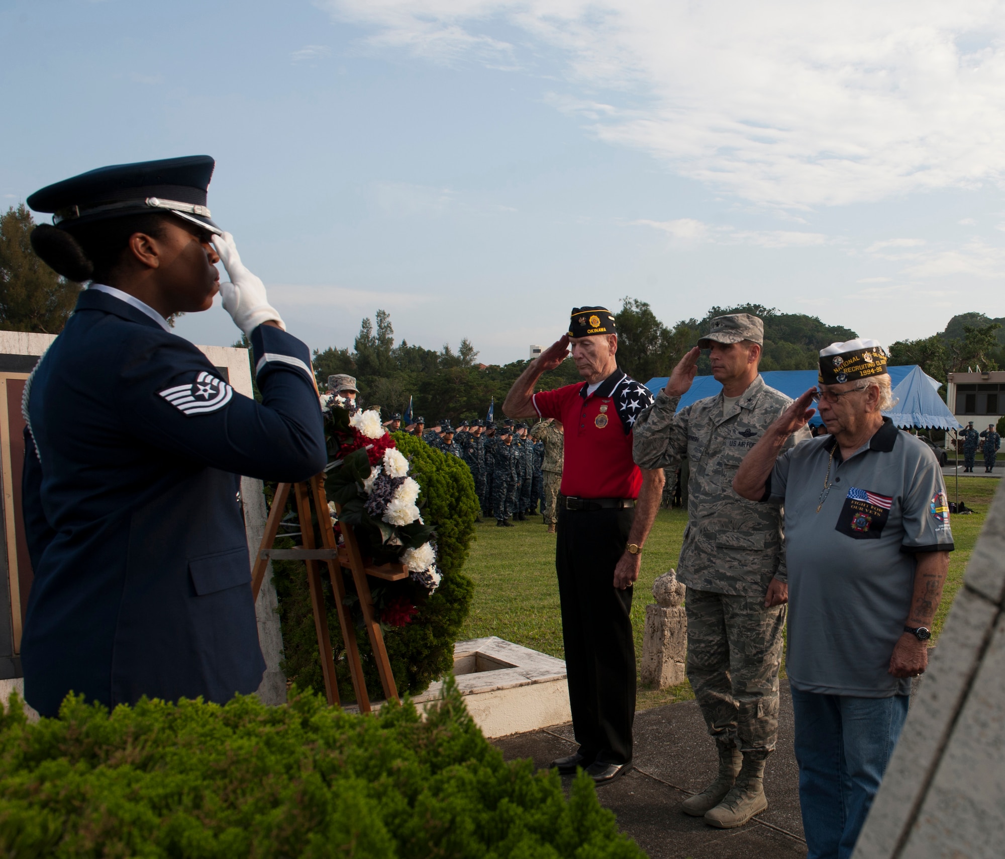 Members of Veterans of Foreign Wars Post 9723 and U.S. Air Force Brig. Gen. Barry Cornish, 18th Wing commander, salute the Prisoner of War/Missing in Action wreath during a Veterans Day ceremony Nov. 11, 2015, at Kadena Air Base, Japan. The wreath was placed to honor those who have paid the ultimate price in the defense of our country. (U.S. Air Force photo by Airman 1st Class Lynette M. Rolen)