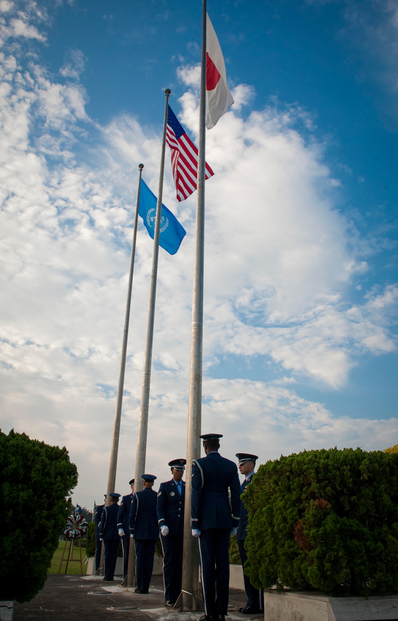 Members of the Kadena Honor Guard stand at attention after the flag is raised during a Veterans Day ceremony Nov. 11, 2015, at Kadena Air Base, Japan. The importance of the flag was discussed as it was raised. The American flag has flown in every war for more than 200 years. (U.S. Air Force photo by Airman 1st Class Lynette M. Rolen)