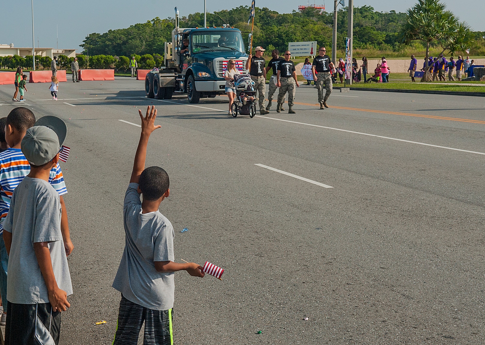 Children watch as Airmen from the 18th Logistics Readiness Squadron roll past in the Veterans Day parade Nov. 11, 2015, at Kadena Air Base, Japan. In 1968 the Uniform Holidays Bill was passed by Congress and moved the celebration of Veterans Day to the fourth Monday in October. The law went into effect in 1971, but in 1975 President Ford returned Veterans Day to November 11, due to the important historical significance of the date. (U.S. Air Force photo by Airman 1st Class Nicholas Emerick)
