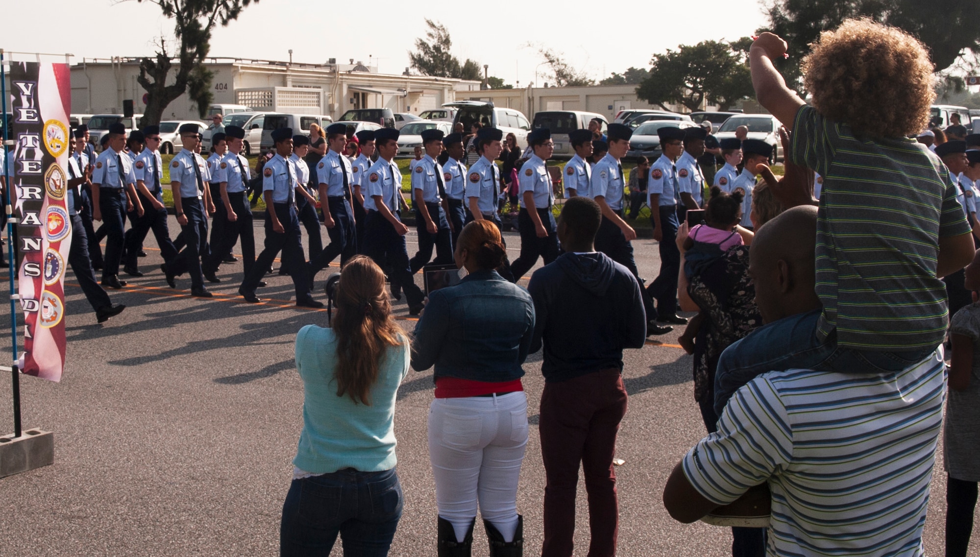 Members of the Kadena High School Junior Reserve Officer Training Corps march in the Veterans Day parade Nov. 11, 2015, at Kadena Air Base, Japan. Veterans Day, originally known as Armistice Day, was first observed to commemorate the armistice which went into effect Nov. 11, 1918, and led to the end of World War I. (U.S. Air Force photo by Airman 1st Class Nicholas Emerick)