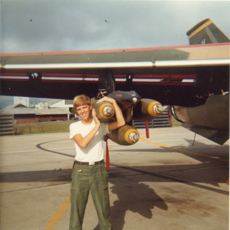 Floyd Siepmann served in the 474th Tactical Fighter Wing at Nellis in the release shop.  He deployed to Southeast Asia for the first time at Takhli RTAFB in late 1972.  Here he stands with an F-111A carrying a full load of Mk 82 500-lb bombs.  (Courtesy Floyd Siepmann)