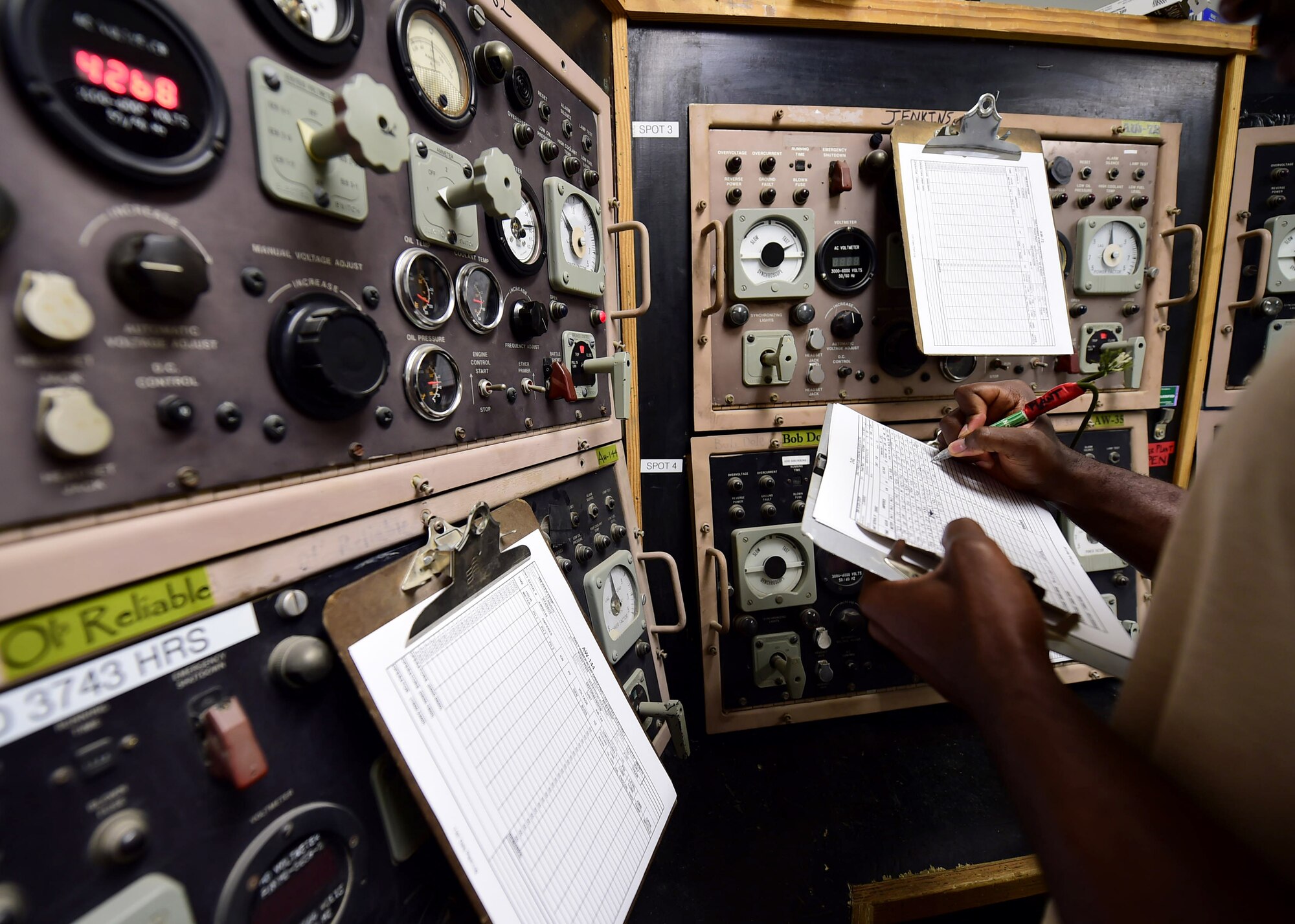 Staff Sgt. Karl Direny, a 386th Expeditionary Civil Engineer Squadron electrical power production craftsman, records a generator’s amp meter reading at an undisclosed location in Southwest Asia, Nov. 6, 2015. The power production shop operates and maintains nearly 100 generators used to provide electricity to the installation. Direny is deployed in support of Operation INHERENT RESOLVE from the 30th Civil Engineer Squadron in Vandenberg Air Force Base, California. (U.S. Air Force photo by Staff Sgt. Jerilyn Quintanilla)