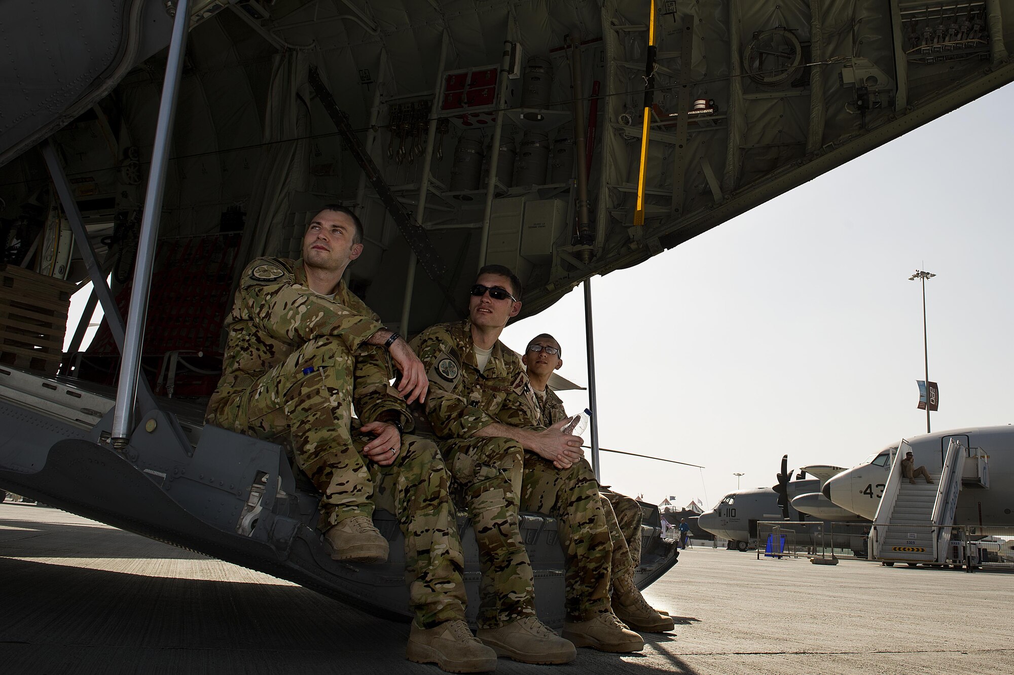 U.S. Air Force Airmen from the 39th Airlift Squadron watch aircraft perform maneuvers, Nov. 10, 2015 at the 2015 Dubai Airshow. The airshow is a biennial event and is recognized as the premier aviation and air industry event in the Gulf and Middle East region and is one of the largest air shows in the world. (U.S. Air Force photo by Tech. Sgt. Nathan Lipscomb)