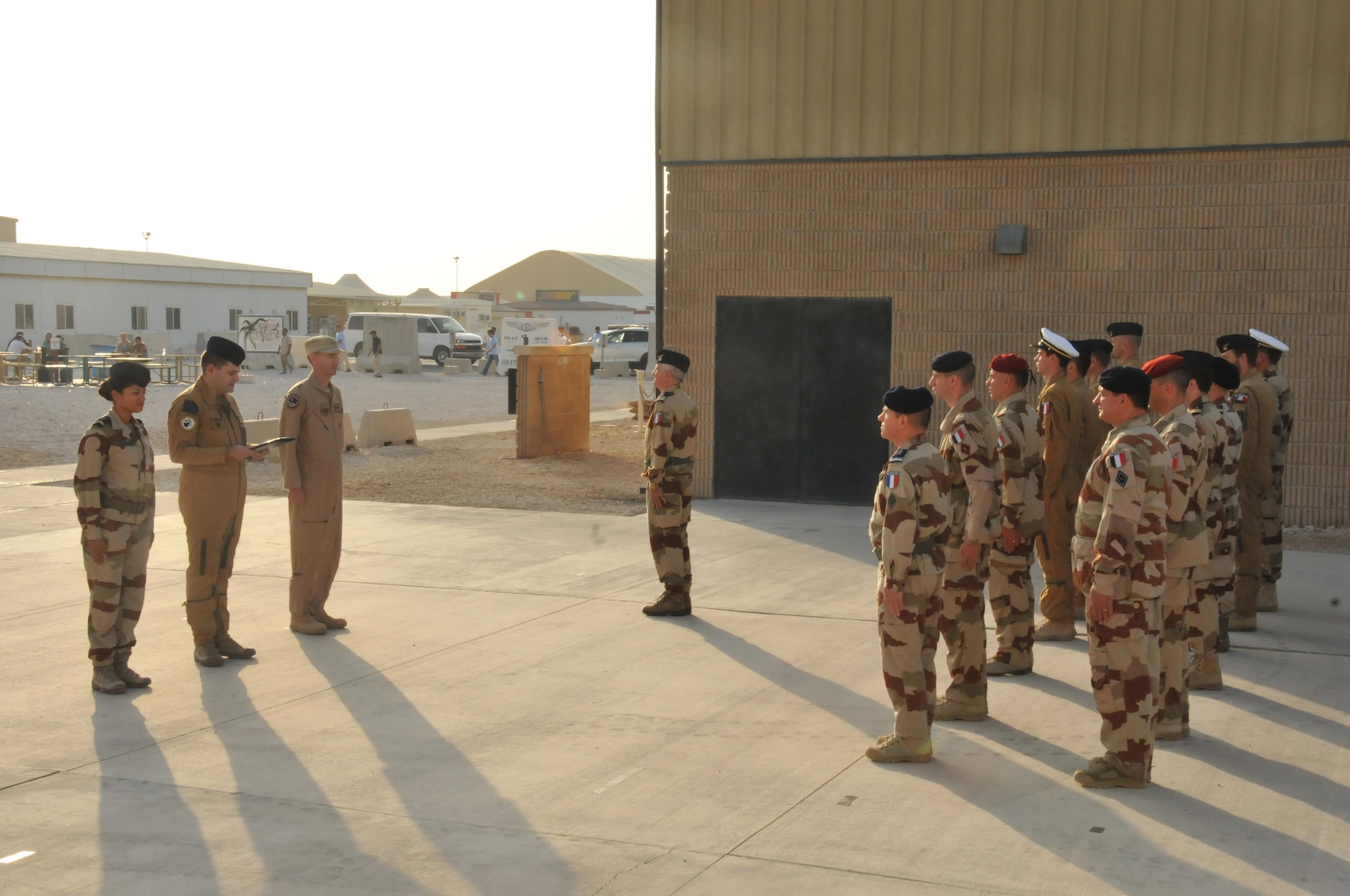 French soldiers honor the reading Order of the day #5961 Nov. 11 at Al Udeid Air Base, Qatar. The address was read by Marshal Foch in 1918. Coalition members also showed their support. (U.S. Air Force photo by Tech. Sgt. Terrica Y. Jones/released)