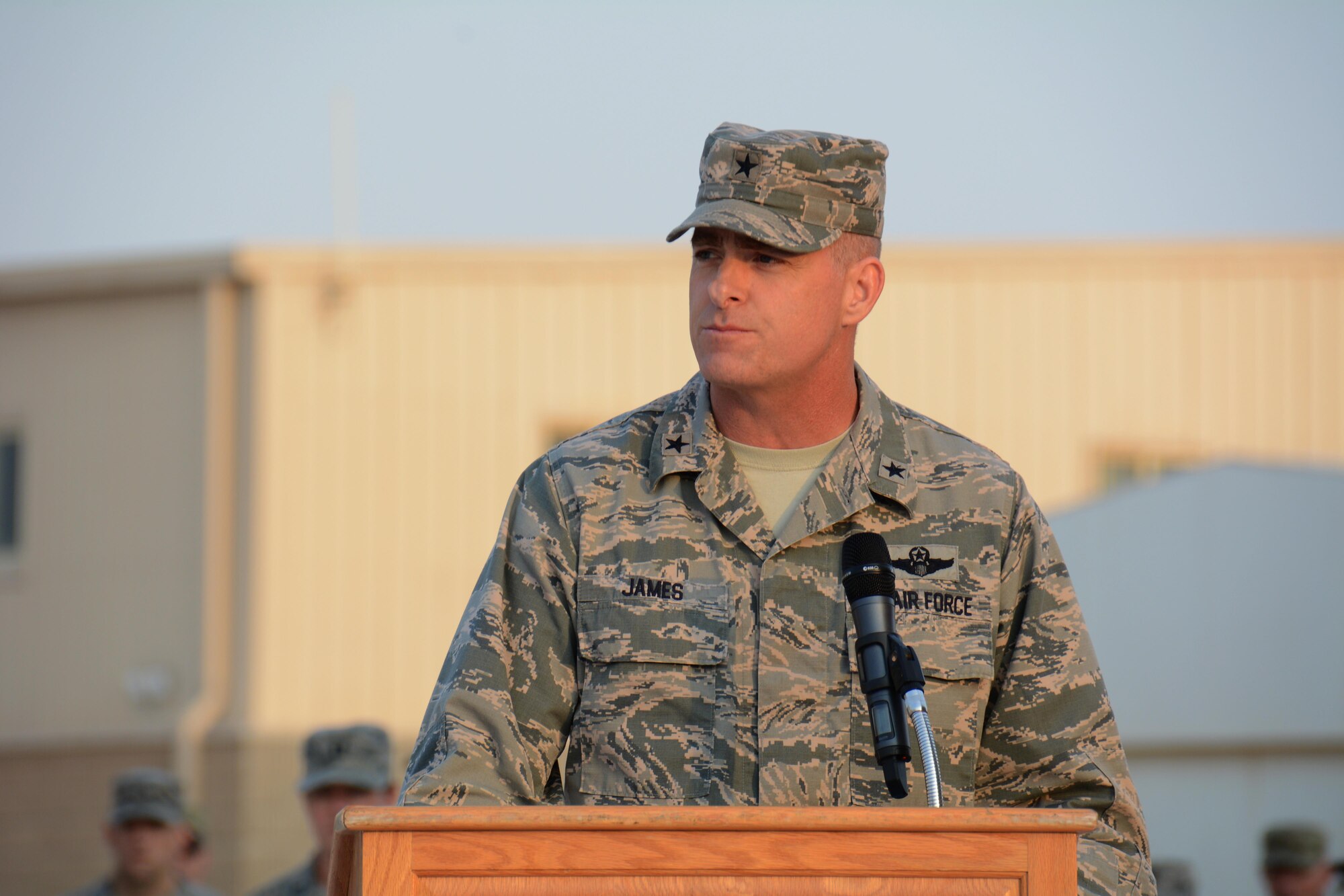 Brig. Gen. Darren James, 379th Air Expeditionary Wing commander, addresses hundreds of service members during a speech at Al Udeid Air Base, Qatar Nov. 11 during the base’s Veterans Day ceremony. The base held a retreat ceremony to honor America’s veterans past and present. James said it’s vital to honor the service and sacrifice of the men and women who defend America, as well as the families of those service members. (U.S. Air Force photo by Tech. Sgt. James Hodgman/Released)