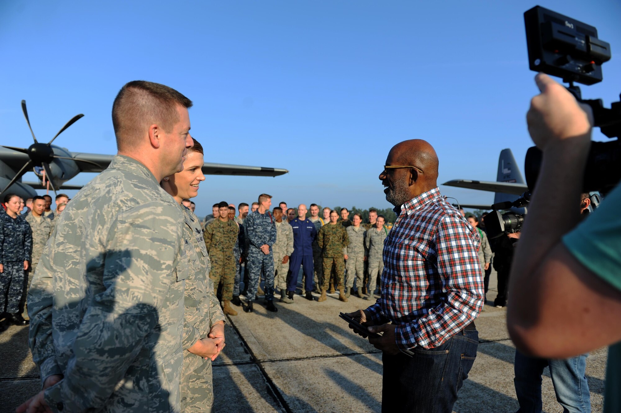 Cols. Frank Amodeo, 403rd Wing commander and Michele Edmondson, 81st Training Wing commander, speaks with Al Roker, TODAY Show weather anchor, following Roker’s weather report during a segment of the TODAY Show on the flight line at Keesler Air Force Base, Miss. Nov. 11, 2015. Keesler was one stop during the show’s Rokerthon 2 as Roker attempts a world record by reporting national and local weather from all 50 states. (U.S. Air Force photo by Kemberly Groue)