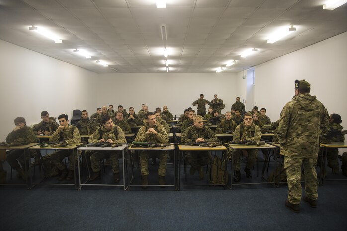 U.S. Marines with 2nd Intelligence Battalion and British soldiers attend a brief before firing at a range in Edinburgh, U.K., Nov. 4, 2015. The forces partnered for Exercise Phoenix Odyssey II, which was designed to bolster joint intelligence operations and build on basic military skills. (U.S. Marine Corps photo by Lance Cpl. Erick Galera/Released)