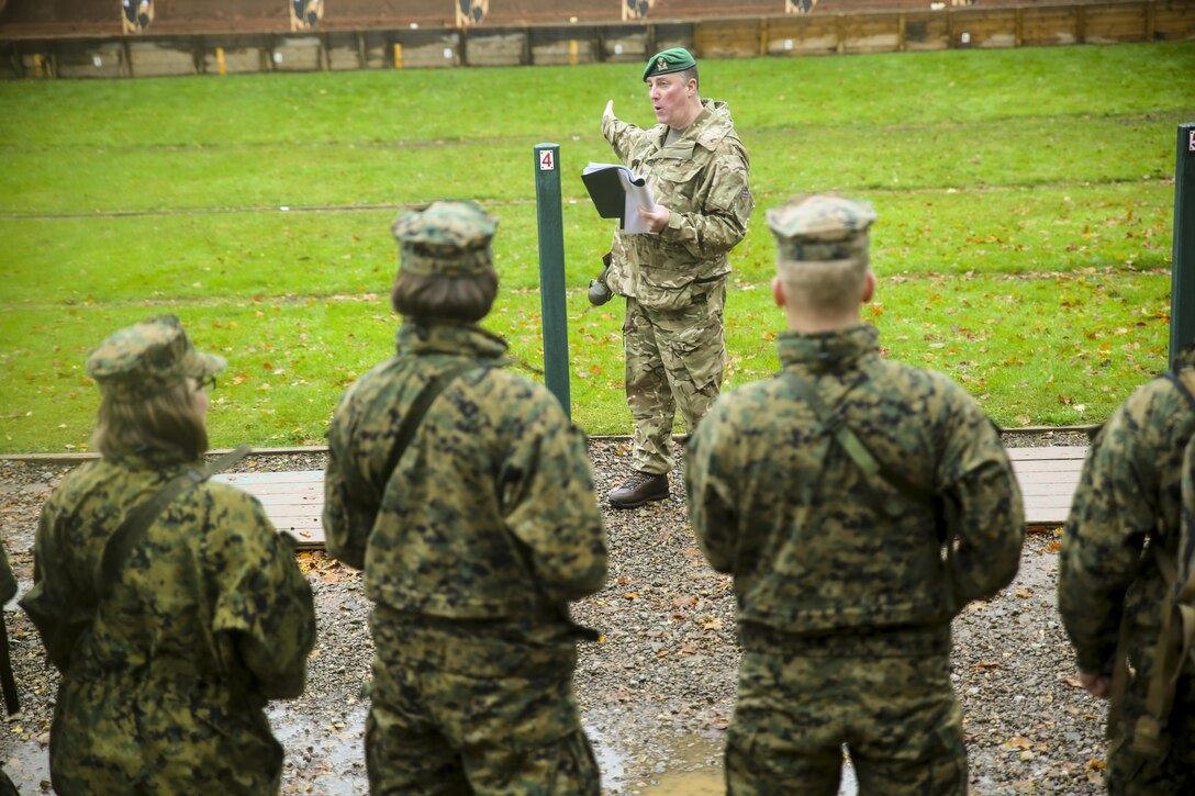U.S. Marines with 2nd Intelligence Battalion and British soldiers get briefed before conducting a range in Edinburgh, U.K., Nov. 4, 2015. The service members participated in a shooting competition as part of Exercise Phoenix Odyssey II, which builds joint intelligence operations and basic military skills. (U.S. Marine Corps photo by Lance Cpl. Erick Galera/Released)