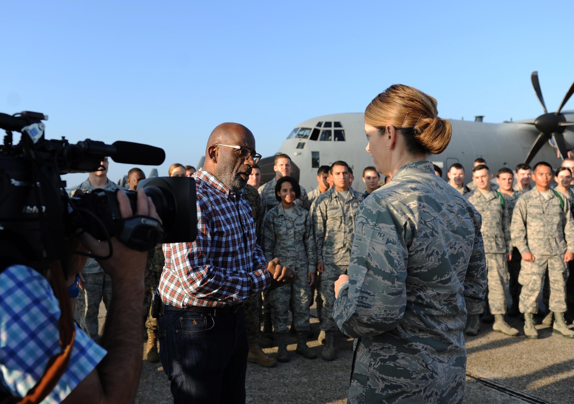 Al Roker, TODAY Show weather anchor, speaks with Col. Michele Edmondson, 81st Training Wing commander, following Roker’s weather report during a segment of the TODAY Show on the flight line at Keesler Air Force Base, Miss. Nov. 11, 2015. Keesler was one stop during the show’s Rokerthon 2 as Roker attempts a world record by reporting national and local weather from all 50 states. (U.S. Air Force photo by Kemberly Groue)