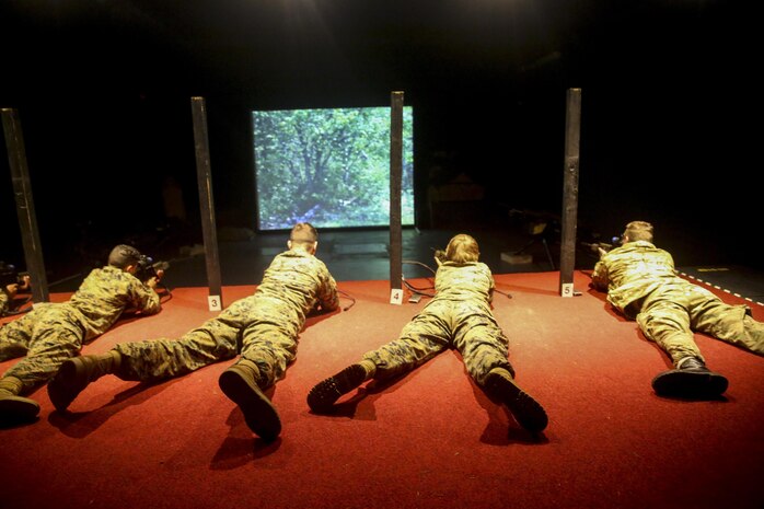 U.S. Marines with 2nd Intelligence Battalion and British soldiers rehearse combat scenarios at a Digital Combat Simulator in Edinburgh, U.K., Nov. 4, 2015. The scenario helped service members practice their shooting, communication and decision making skills to better prepare them for real life confrontations, and ultimately enhance interoperability. The forces conducted Exercise Phoenix Odyssey II which helped increase joint intelligence operations and military skills. (U.S. Marine Corps photo by Lance Cpl. Erick Galera/Released)