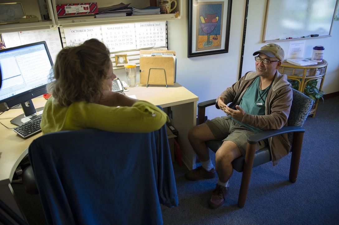 Rose Stauffer, a licensed clinical social worker, left, listens to her client Manuel “Al” Alcantara during a therapy session  at the inpatient posttraumatic stress disorder clinic at the Bay Pines Veterans Administration Healthcare Center in Bay Pines, Fla. Oct. 29, 2015. (DoD News photo by EJ Hersom)