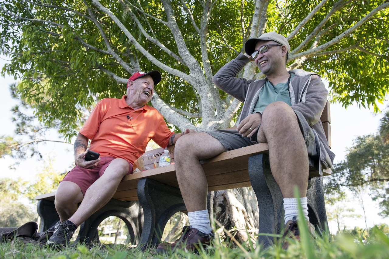 Army veteran Manuel “Al” Alcantara, right, and Vietnam veteran Jim Alderman share stories beside a duck pond after a day’s therapy at the inpatient post-traumatic stress disorder clinic at Bay Pines Veterans Affairs Medical Center in Bay Pines, Fla., Oct. 29, 2015. DoD photo by EJ Hersom